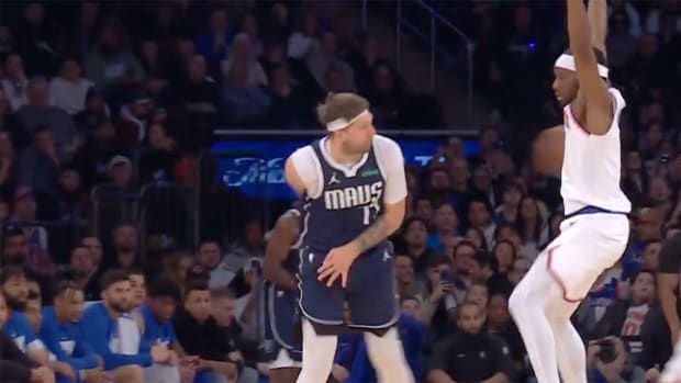 Dallas Mavericks’ Luka Doncic passes against New York Knicks’ Precious Achiuwa